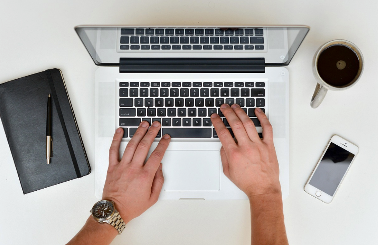A person filling out a patent application online